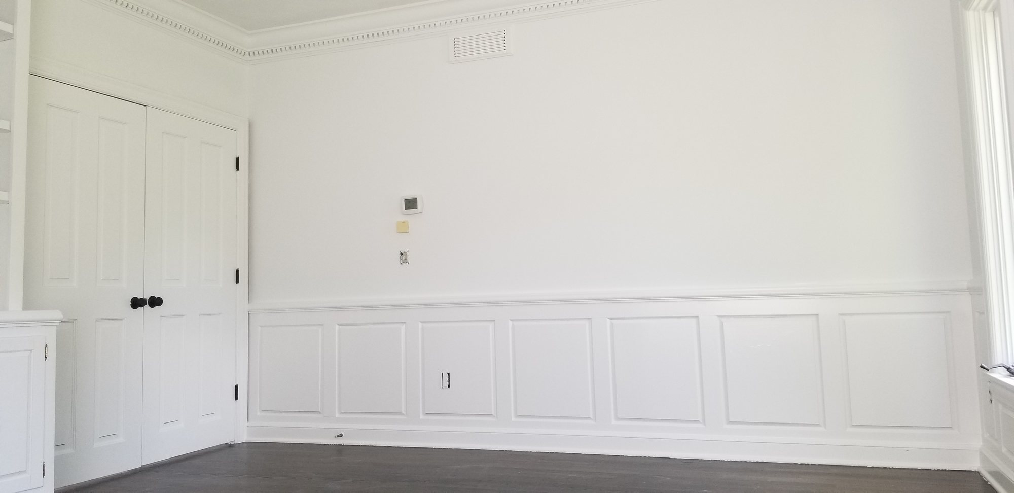 Wainscoting door trim painted white after — Segor Painting, Columbus OH